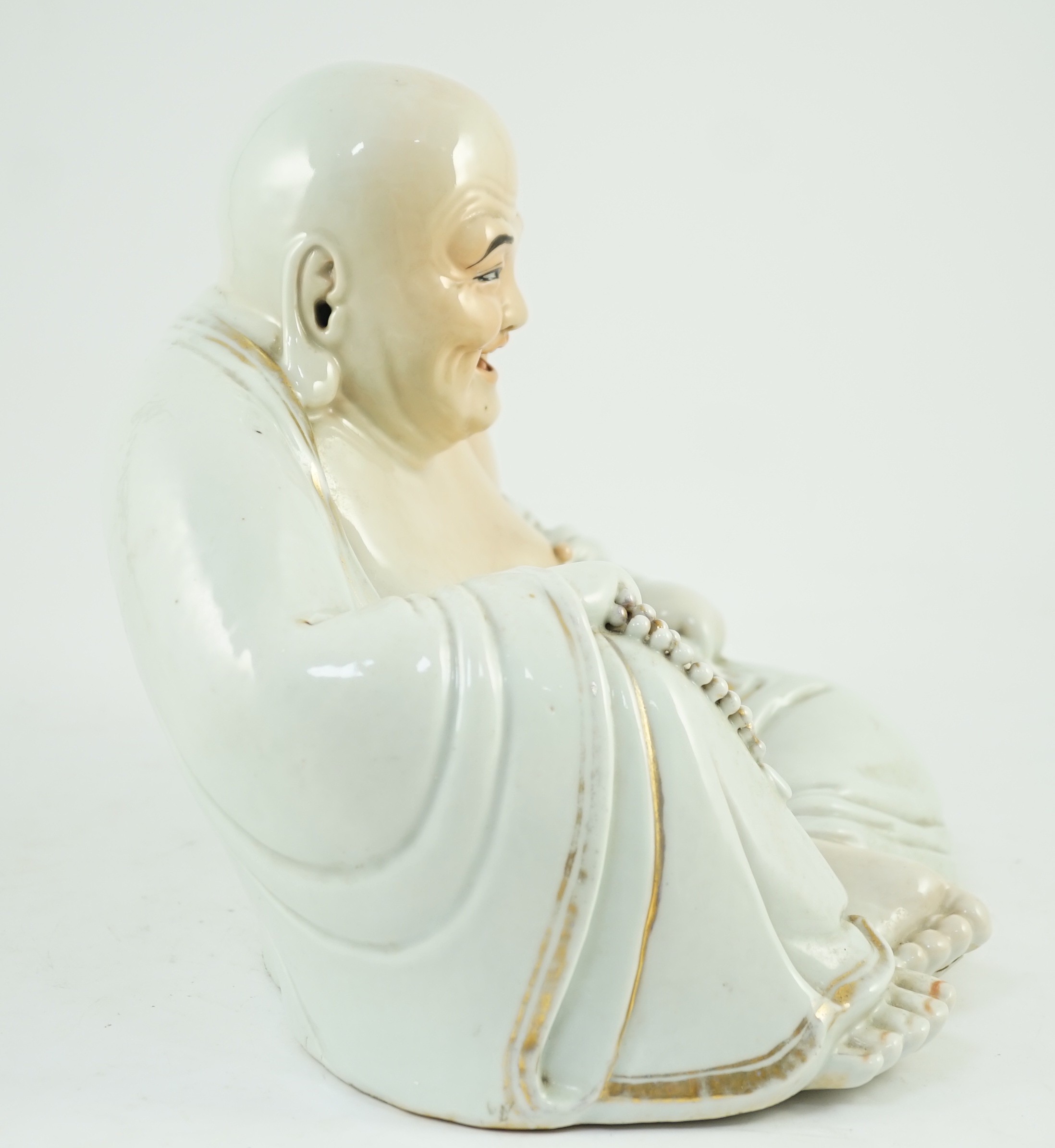 A large Chinese porcelain figure of Budai, Republic period, 25cms high